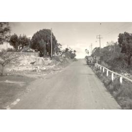 Woodland Street, view up slope, with parked car, Balgowlah Heights, c1940s