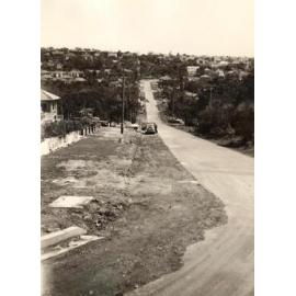 Unidentified street with rough edge and steep incline, c1940s