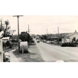 Unidentified suburban street cars and houses, c1940s