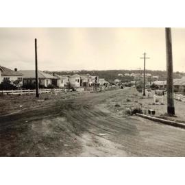 Construction continues on an unidentified unsealed road, c1940s