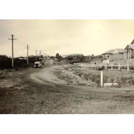 Roadworks continue on an unidentified unsealed road, c1940s
