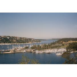 View of the approaches to the Spit Bridge showing explosives wharf left side of the marina shop, 1988