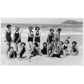 Group of girls from Manly Grammar School posing on Manly Beach, Manly, c1930