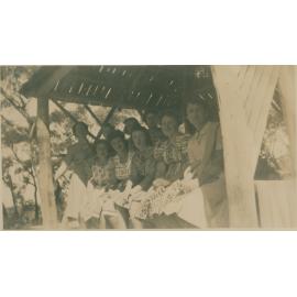Nine Women Sitting Under a Shelter, Narrabeen, 1943