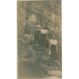 Five women standing on stairs, Narrabeen, 1943