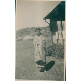A woman draped in a blanket, Narrabeen, 1943