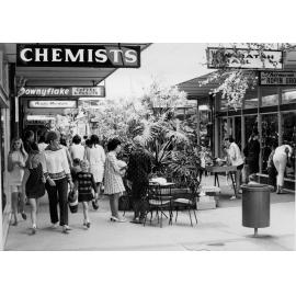 People walking through an arcade at Warringah Mall, Brookvale, c1967-1973