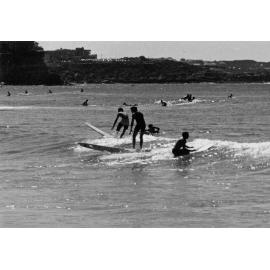 Surfing at Manly Beach with a view of Freshwater in the background, Manly, 1972