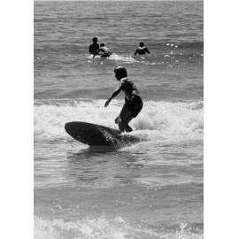 Surfer on a small wave at Manly Beach, Manly, 1972