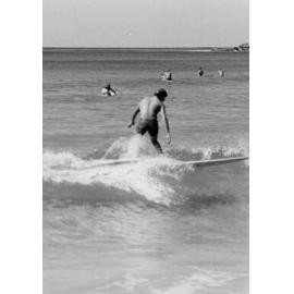 Surfer riding a wave at Manly Beach, Manly, 1972