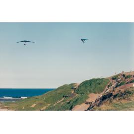 Hang gliders above coastal dunes near Long Reef golf course, Long Reef, 1992