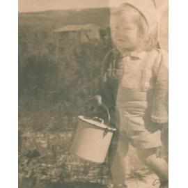 Jenny van der Pot with milk billy, Boomerang Road, Collaroy Plateau, c1946