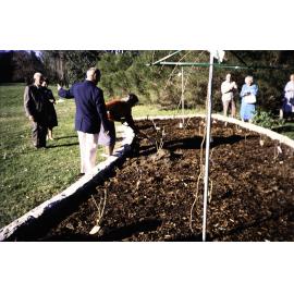 Two individuals planting at the opening of the Nelson Heather Centre Bicentennial Rose Garden, Warriewood, 1988