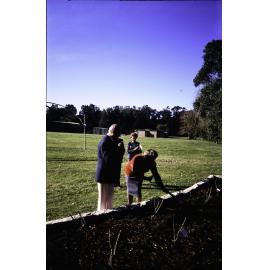 Two individuals planting at the opening of the Nelson Heather Centre Bicentennial Rose Garden, Warriewood, 1988