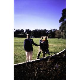 Two individuals planting at the opening of the Nelson Heather Centre Bicentennial Rose Garden, Warriewood, 1988